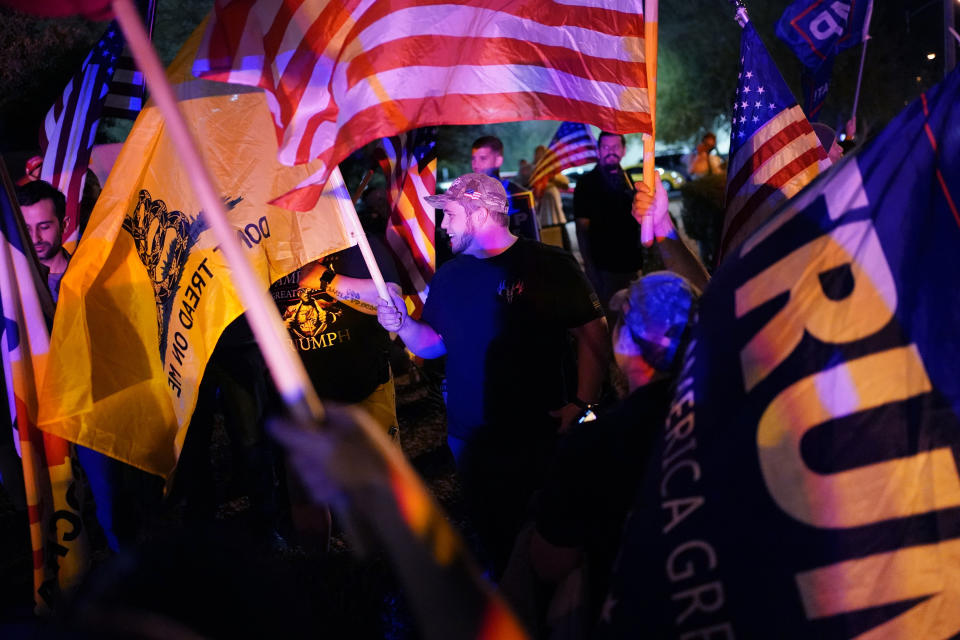 FILE - In this Nov. 5, 2020 file photo, supporters of President Donald Trump protest the Nevada vote in front of the Clark County Election Department in Las Vegas. A review by The Associated Press in the six battleground states disputed by former President Trump has found fewer than 475 cases of potential voter fraud, a minuscule number that would have made no difference in the 2020 presidential election. Democrat Joe Biden won Arizona, Georgia, Michigan, Nevada, Pennsylvania and Wisconsin and their 79 Electoral College votes by a combined 311,257 votes out of 25.5 million ballots cast for president. (AP Photo/John Locher, File)