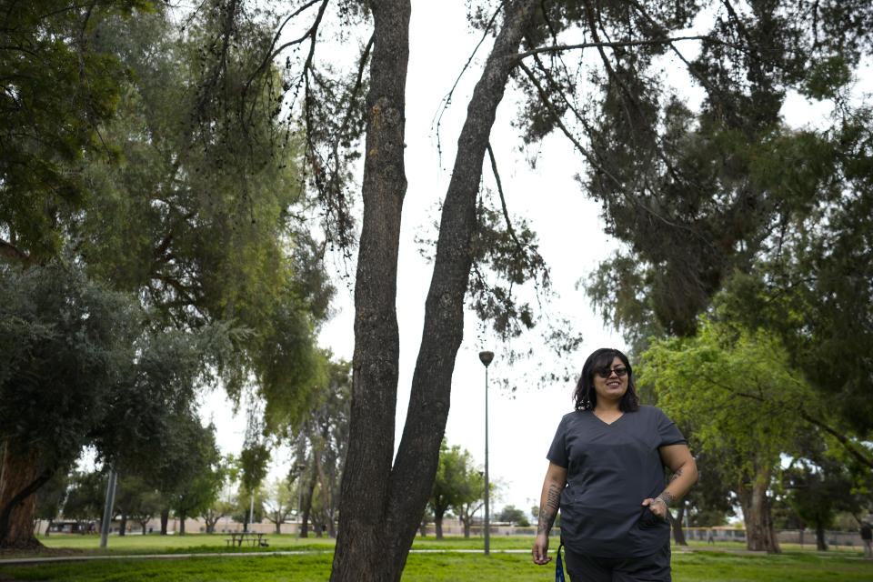 Vanessa Martinez poses for a photo on Monday, March 20, 2023, in Chandler, Ariz. Martinez was shot in the head by her ex-boyfriend in September 2021, and was denied victim compensation due to unrelated outstanding court fines, some from a decade earlier. (AP Photo/Ashley Landis)