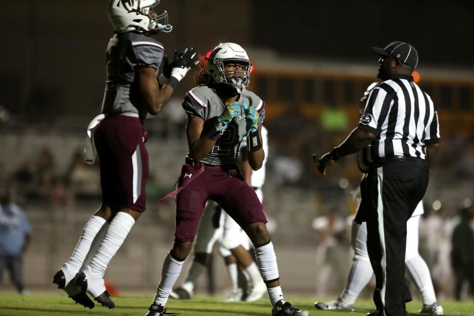 Rancho Mirage HighÕs Kobee Finnikin (4) and Jeremiah Johnson (2) react after a touchdown by Finnikin during the first half against Tahquitz in Rancho Mirage, Calif. on August 31, 2023. Tahquitz won 45-21.