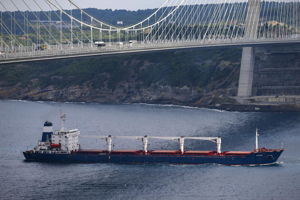 The Sierra Leone-flagged cargo ship Razoni sails under Yavuz Sultan Selim Bridge after being inspected by Russian, Ukrainian, Turkish and U.N. officials at the entrance of the Bosphorus Strait in Istanbul, Turkey, Wednesday, Aug. 3, 2022. Razoni, loaded up with 26,000 tons of corn, is the first cargo ship to leave Ukraine since the Russian invasion, and set sail from Odesa on Monday, August 1, 2022. Its final destination is Lebanon. (AP Photo/Emrah Gurel)