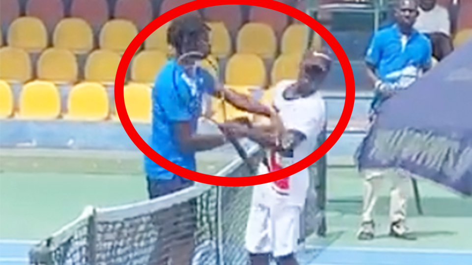 France teenager Michael Kouame (pictured left) slaps Raphael Nii Ankrah (pictured right) at the net after a tennis match.