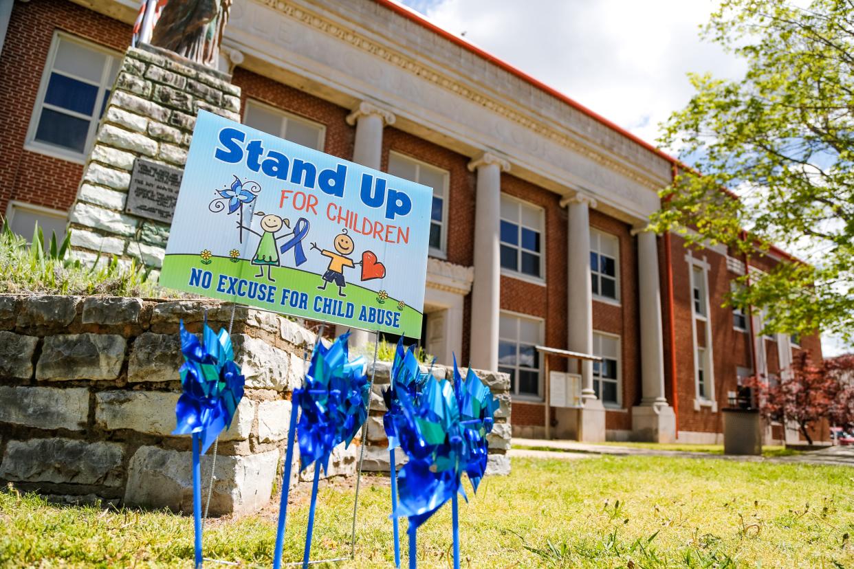 A sign that reads “Stand Up for Children, No Excuse for Child Abuse” was put up last year in front of the Seminole County Courthouse in Wewoka.