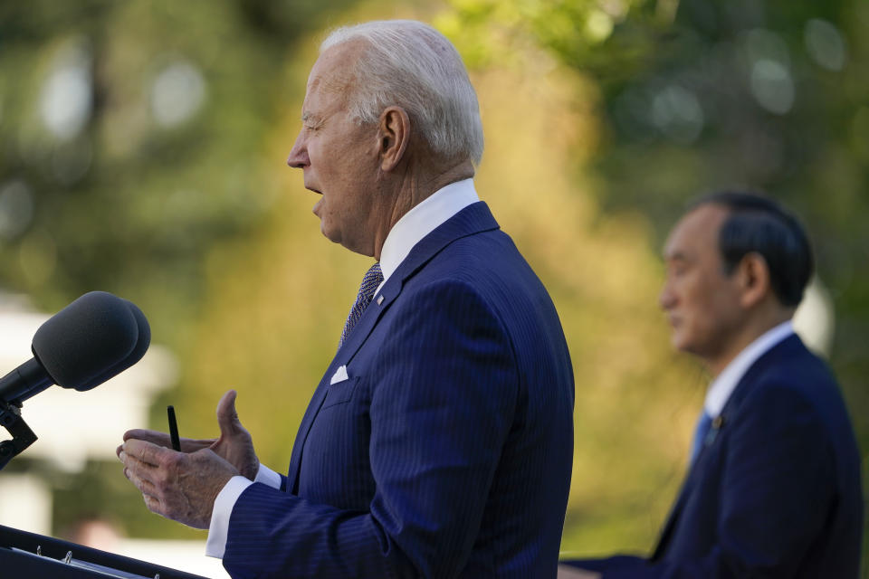 President Joe Biden, accompanied by Japanese Prime Minister Yoshihide Suga, speaks at a news conference in the Rose Garden of the White House, Friday, April 16, 2021, in Washington. (AP Photo/Andrew Harnik)