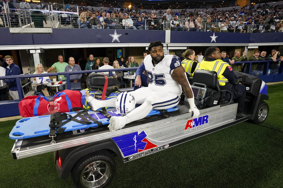 Dallas Cowboys defensive tackle Johnathan Hankins leaves the field on a medical cart during the second half of an NFL football game against the Philadelphia Eagles, Sunday, Dec. 10, 2023, in Arlington, Texas. (AP Photo/Sam Hodde)