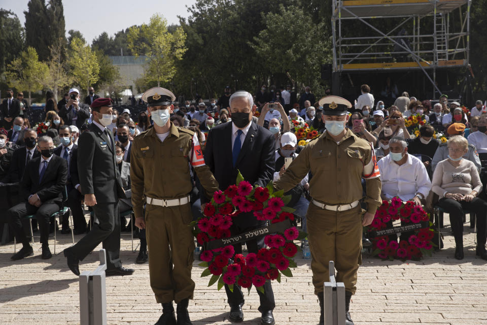 Israeli Prime Minister Benjamin Netanyahu prepares to lay a wreath at a ceremony marking the annual Holocaust Remembrance Day at Yad Vashem Holocaust Memorial in Jerusalem, Thursday, April 8, 2021. (AP Photo/Maya Alleruzzo, Pool)