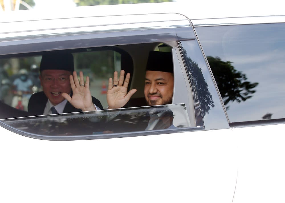 Perak PKR chief Farhash Wafa Salvador Rizal Mubarak and Perak DAP chairman Nga Kor Ming are seen leaving Istana Kinta in Ipoh December 5, 2020. ― Picture by Farhan Najib