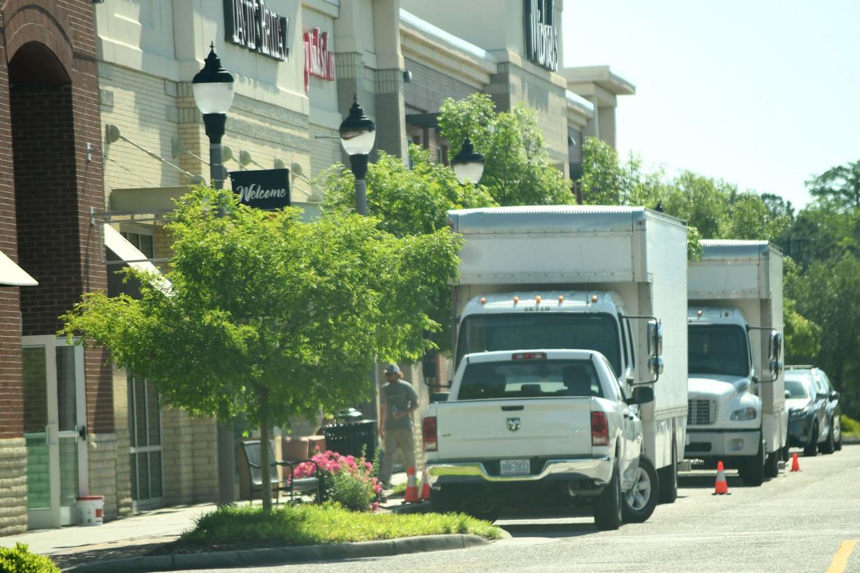 Film crews for the Amazon series "The Summer I Turned Pretty" outside David's Bridal in the Mayfaire shopping center April 23 in Wilmington.
