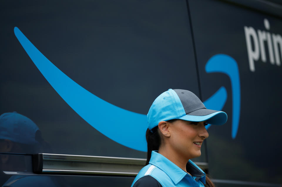 Amazon senior manager of product management Parisa Sadrzadeh stands in front of an Amazon Prime van in Seattle, June 27, 2018. REUTERS/Lindsey Wasson