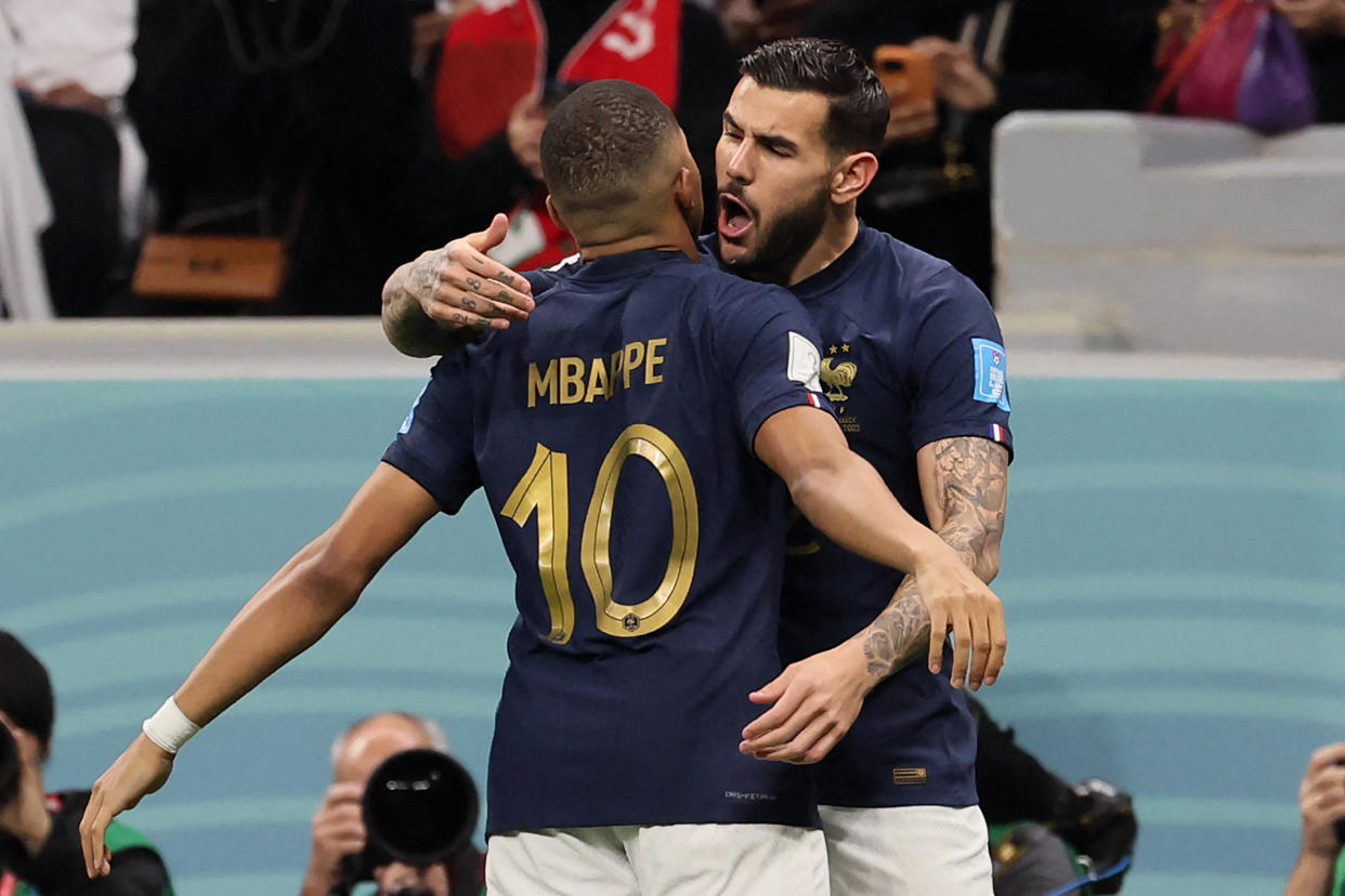 France's defender #22 Theo Hernandez (R) celebrates with France's forward #10 Kylian Mbappe after scoring his team's first goal during the Qatar 2022 World Cup semi-final football match between France and Morocco at the Al-Bayt Stadium in Al Khor, north of Doha on December 14, 2022. (Photo by KARIM JAAFAR / AFP) (Photo by KARIM JAAFAR/AFP via Getty Images)