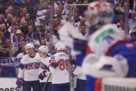 Unted States' Luke Hughes celebrates with teammates after scoring his side's fourth goal during the preliminary round match between United States and Slovakia at the Ice Hockey World Championships in Ostrava, Czech Republic, Monday, May 13, 2024. (AP Photo/Darko Vojinovic)