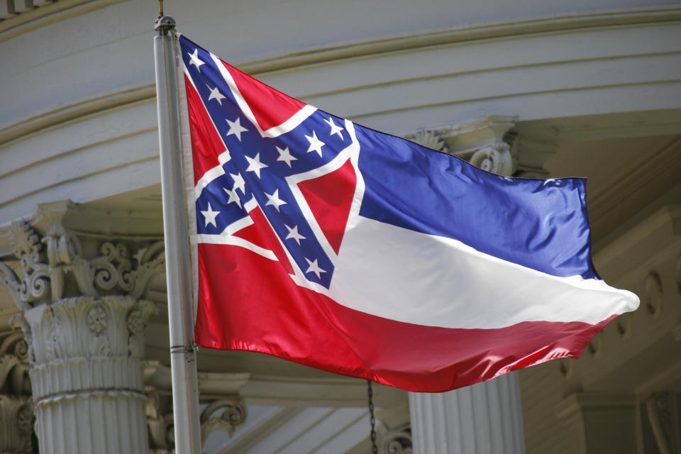 The state flag of Mississippi flies at the Governor's Mansion in Jackson, Mississippi, on Friday, April 26, 2019. / Credit: Rogelio V. Solis / AP