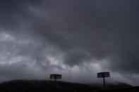 Storm clouds hover over the Fukushima Azuma Baseball Stadium at the 2020 Summer Olympics, Tuesday, July 27, 2021, in Fukushima, Japan. Japan opens the Olympic baseball tournament against the Dominican Republic Wednesday. (AP Photo/Jae C. Hong)