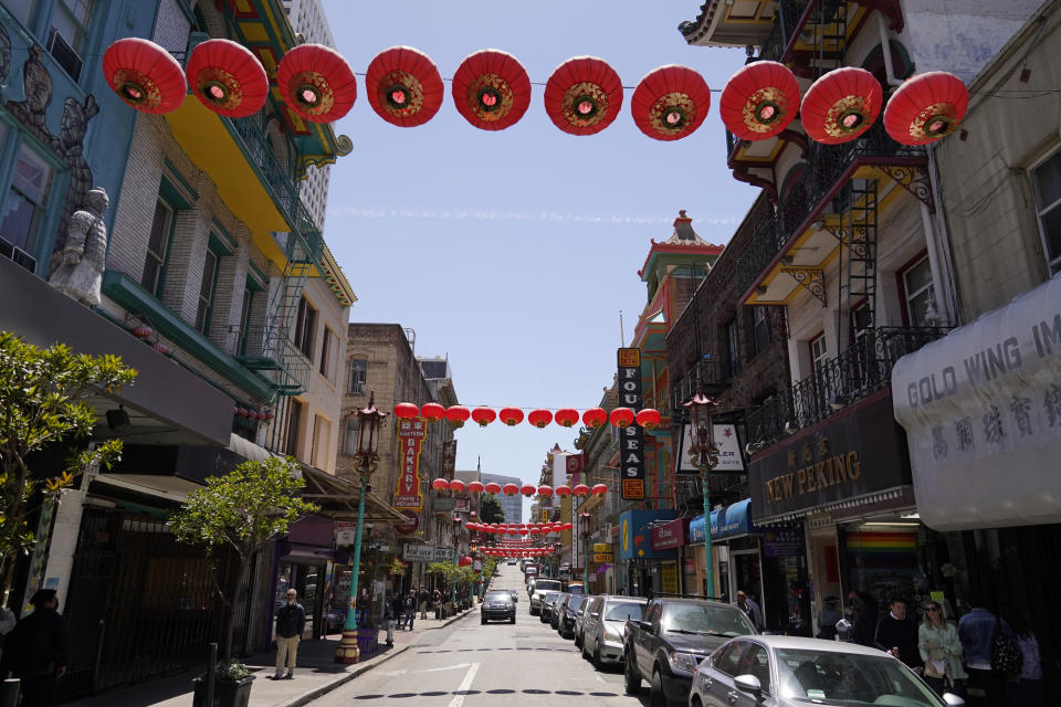 Lanterns hang in Chinatown above Grant Avenue in San Francisco, Monday, May 23, 2022. Chinatowns and other Asian American enclaves across the U.S. are using art and culture to show they are safe and vibrant hubs nearly three years after the start of the pandemic. From an inaugural arts festival in San Francisco to night markets in New York City, the rise in anti-Asian hate crimes has re-energized these communities and drawn allies and younger generations of Asian and Pacific Islander Americans. (AP Photo/Eric Risberg)