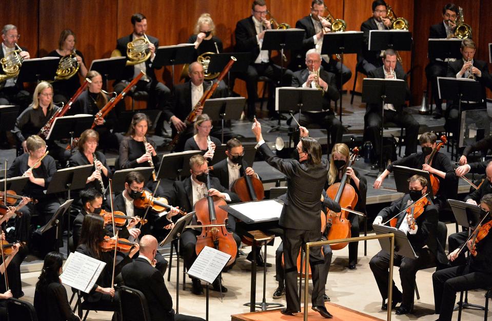 Erie Philharmonic Music Director Daniel Meyer, center, leads the orchestra inside the Warner Theatre on Jan. 23, 2022. The Phil has announced its 2023-24 season lineup.