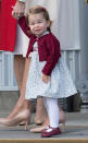 <p>The tot looked adorable in a blue dress with a matching red cardigan and shoes on the final day of her family's royal tour of Canada.</p>