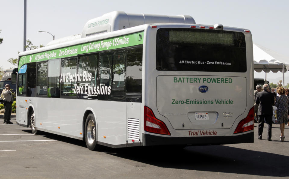 FILE - In this May 1, 2013, file photo, an electric bus produced by China's BYD Co., is parked at the announcement of the opening of an electric bus manufacturing plant in Lancaster, Calif. The California Air Resources Board voted Friday, Dec. 14, 2018, to require that all new buses be carbon-free by 2029. Environmental advocates project that the last dirty buses will phase out by 2040.(AP Photo/Reed Saxon, File)