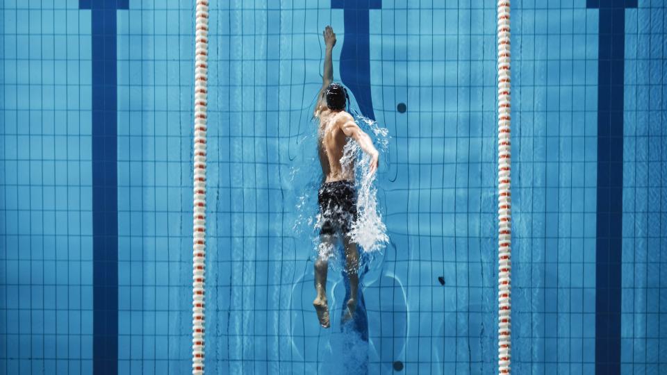 a photo of a man swimming