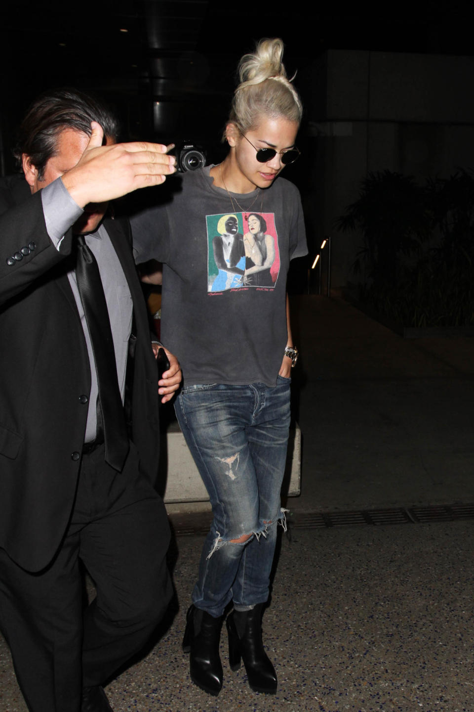 Rita Ora in a vintage Madonna T-shirt and distressed denim jeans.