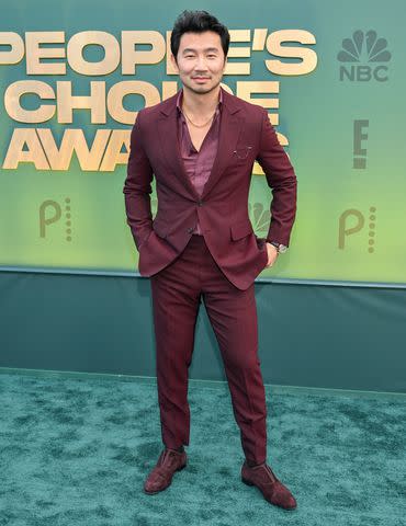 <p> Michael Buckner/WWD via Getty </p> Simu Liu arrives at the People's Choice Awards.