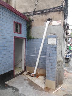 <span class="caption">Self-installed flush toilets like this one in Shanghai often just empty into rainwater drains.</span> <span class="attribution"><span class="source">Deljana Iossifova</span>, <span class="license">Author provided</span></span>