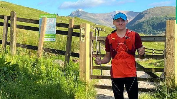 Pawel Cymbalista giving the thumbs up during his Ben Nevis challenge