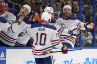 Edmonton Oilers center Derek Ryan (10) celebrates with the bench after his goal against the Tampa Bay Lightning during the first period of an NHL hockey game Saturday, Nov. 18, 2023, in Tampa, Fla. (AP Photo/Chris O'Meara)