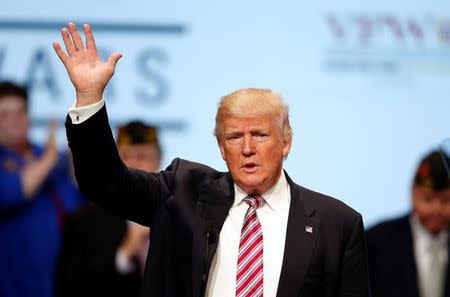 U.S. Republican presidential nominee Donald Trump waves after speaking at the Veterans of Foreign Wars Convention in Charlotte, North Carolina July 26, 2016. REUTERS/Chris Keane