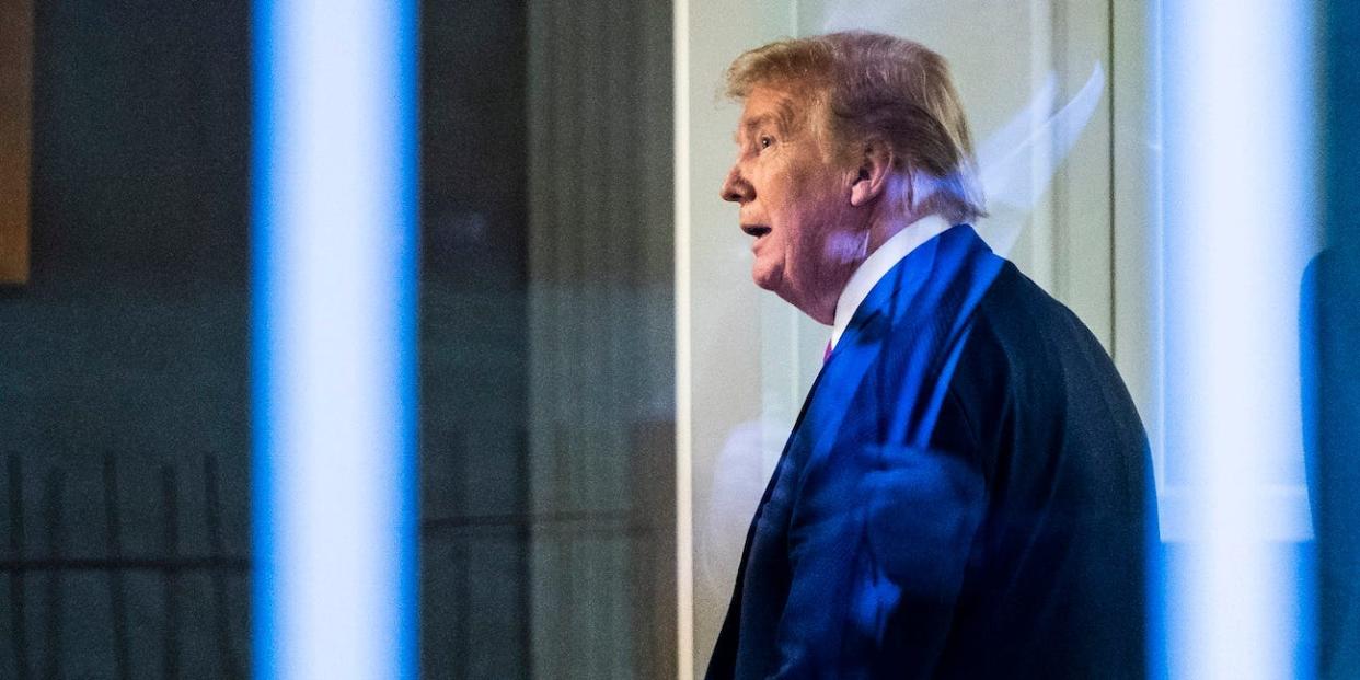 Donald J. Trump, seen through a window, watches a television in the press office as newscasters talk about him moments after he was speaking with members of the coronavirus task force during a briefing in response to the COVID-19 coronavirus pandemic in the James S. Brady Press Briefing Room at the White House on Wednesday, April 22, 2020 in Washington, DC. (