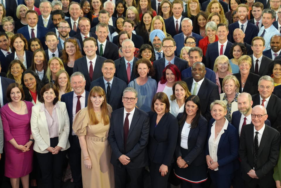 Prime Minister Sir Keir Starmer (center front) next to Deputy Prime Minister Angela Rayner (front row, third from left) and Chancellor Rachel Reeves (front row, fourth from right) stand with Labour Party MPs, some of whom won seats in the 2024 General Election, at Church House in Westminster, central London. Picture date: Monday July 8, 2024. (Photo by Stefan Rousseau/PA Images via Getty Images)