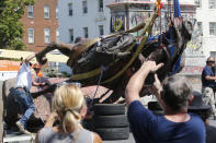 Crews lower the statue Confederate General J.E.B. Stuart in preparation for transport after removing it from it's pedestal on Monument Avenue Tuesday July 7, 2020, in Richmond, Va. The statue is one of several that will be removed by the city as part of the Black Lives Matter reaction. (AP Photo/Steve Helber)