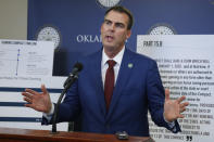 Oklahoma Gov. Kevin Stitt gestures during a news conference concerning the renewal of Tribal Gaming Compacts Thursday, Nov. 14, 2019, in Oklahoma City. (AP Photo/Sue Ogrocki)