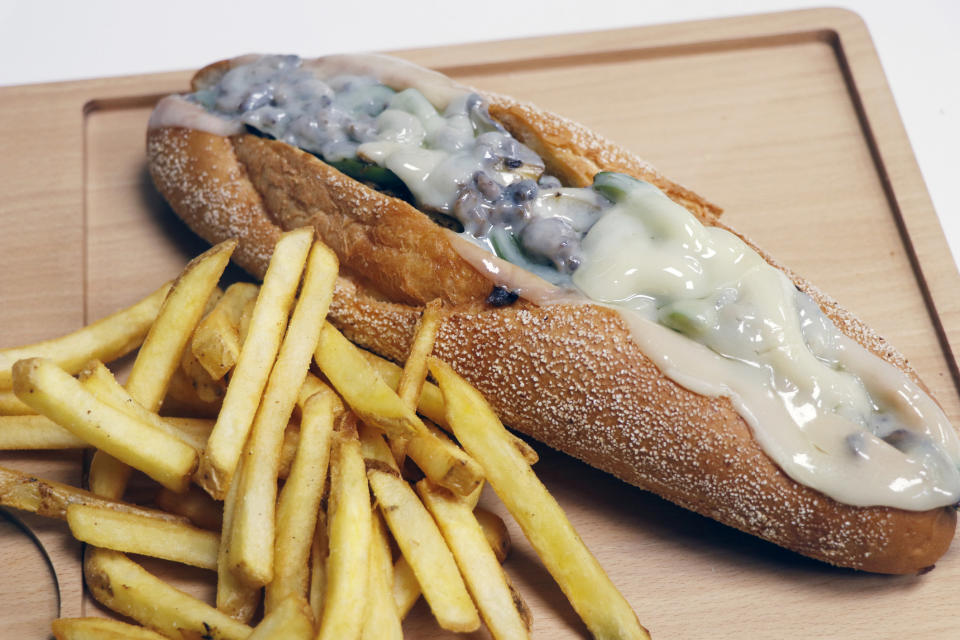Steak sandwich with melted cheese.