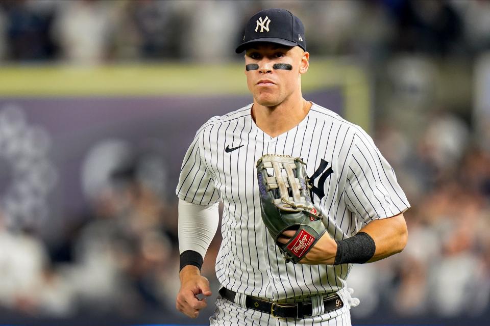 New York Yankees center fielder Aaron Judge comes of the field at the end of the second inning during the second inning of Game 1 of an American League Division baseball series against the Cleveland Guardians, Tuesday, Oct. 11, 2022, in New York. (AP Photo/Frank Franklin II)