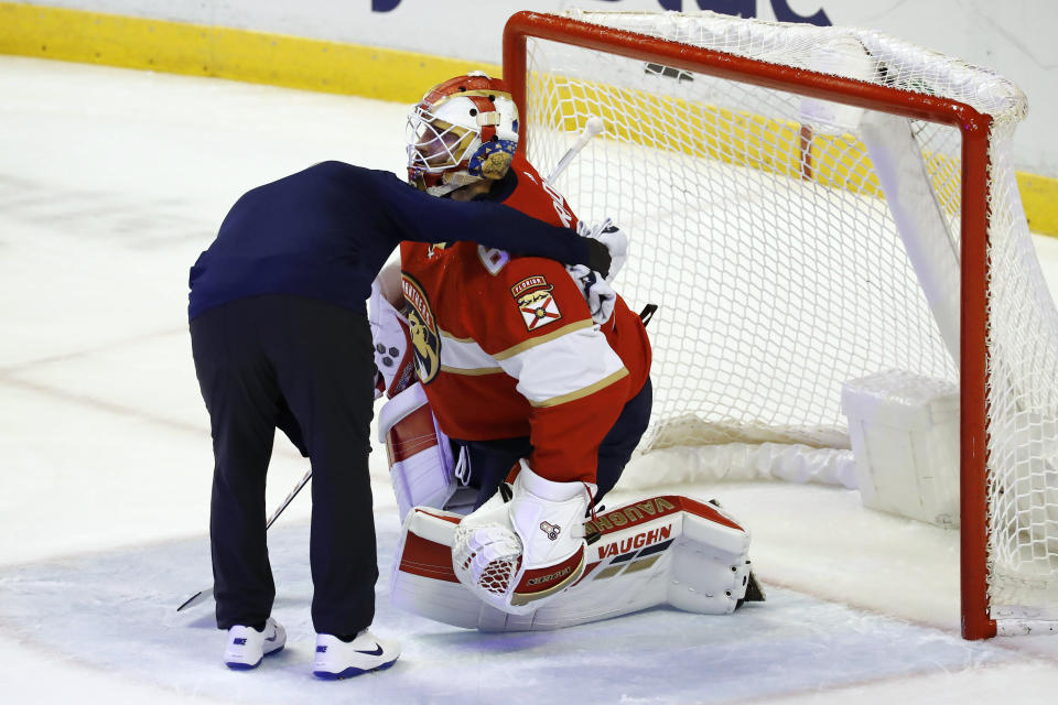 Florida Panthers goaltender Chris Driedger is helped off the ice during the first period of the team's NHL hockey game against the Los Angeles Kings, Thursday, Jan. 16, 2020, in Sunrise, Fla. (AP Photo/Brynn Anderson)