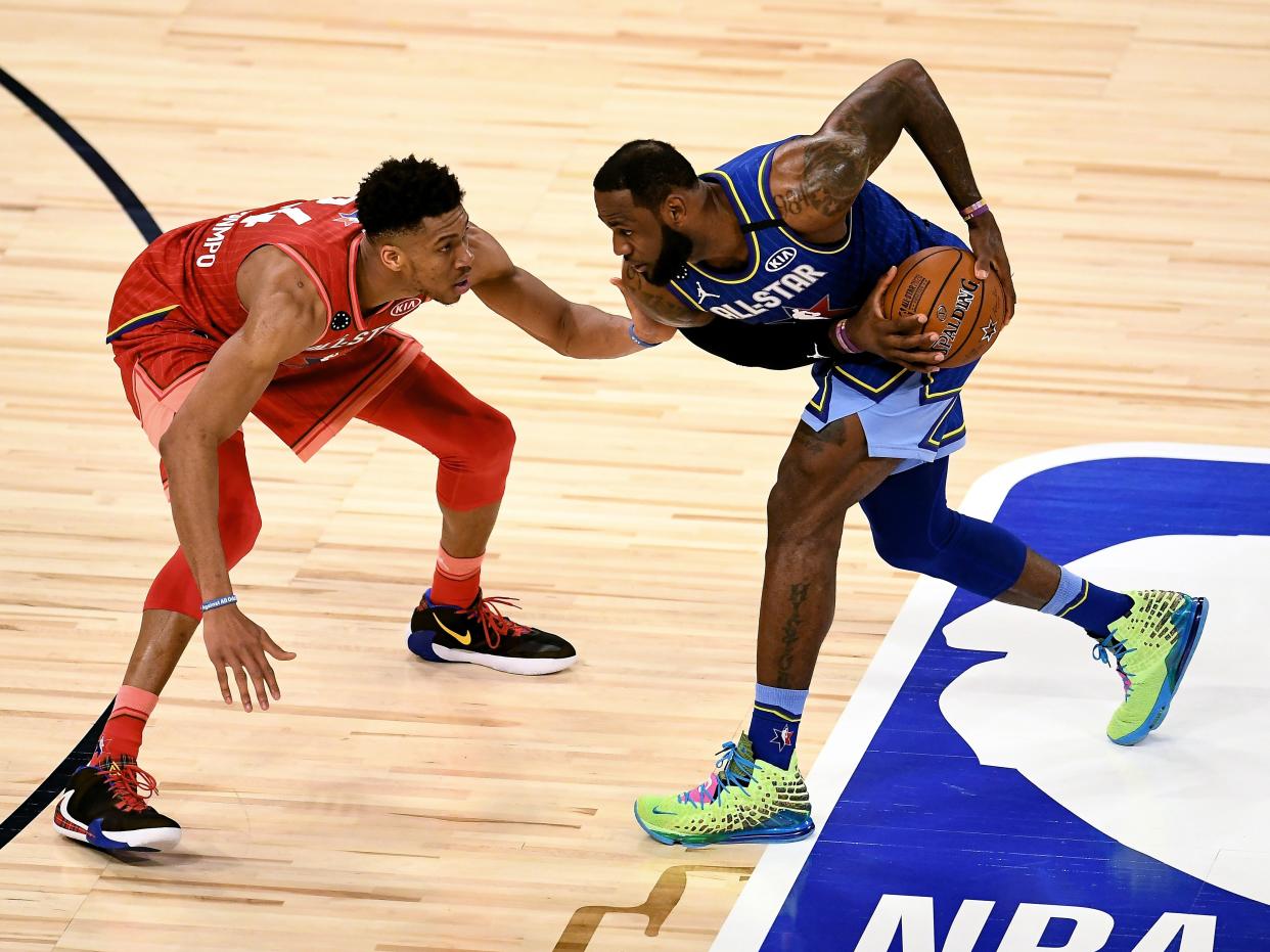 LeBron James handles the ball while being guarded by Giannis Antetokounmpo during the 69th NBA All-Star Game on February 16, 2020 in Chicago, Illinois.  (Getty Images)