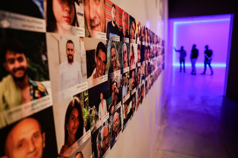 Images depicting hostages, most of whom were kidnapped during the deadly October 7 attack by Palestinian Islamist group Hamas from Gaza, on the wall at the "From Darkness to Light" interactive exhibition in Jerusalem