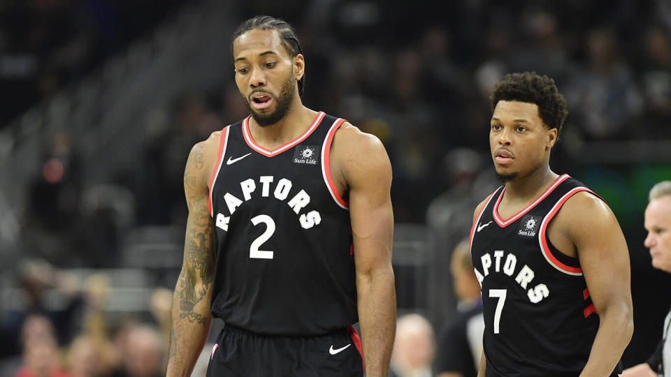 Toronto Raptors forward Kawhi Leonard (2) and Toronto Raptors guard Kyle Lowry (7) react during a break in play first half Game 2 of the NBA basketball Eastern Conference finals against the Milwaukee Bucks in Milwaukee on Friday, May 17, 2019. THE CANADIAN PRESS/Frank Gunn