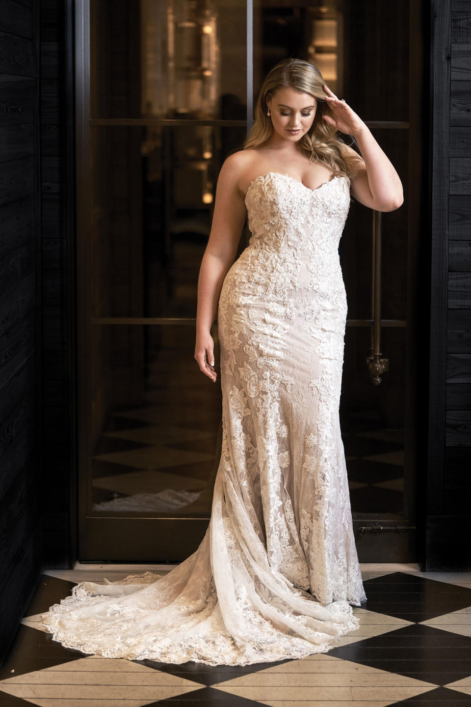 <p>Lawrence wears a strapless lace gown by Justin Alexander. (Photo: courtesy of Justin Alexander) </p>