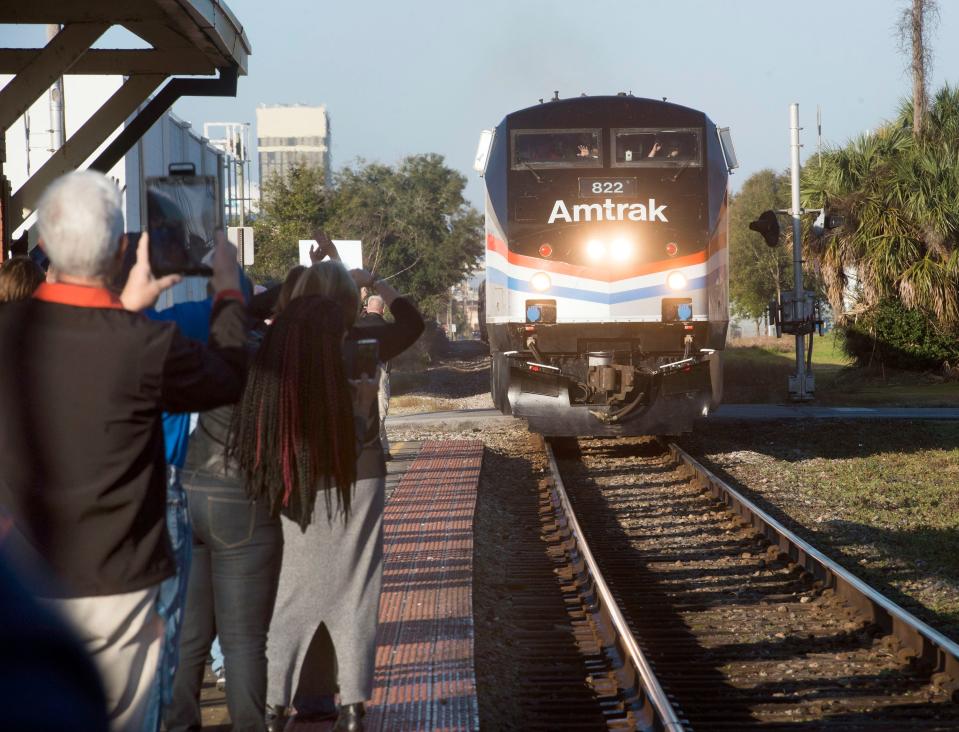 Local residents gather at the Pensacola Train Station Friday morning to welcome an Amtrak train to the city. The Pensacola stop is part of the Southern Rail Commission’s Gulf Coast Passenger Rail Inspection trip.