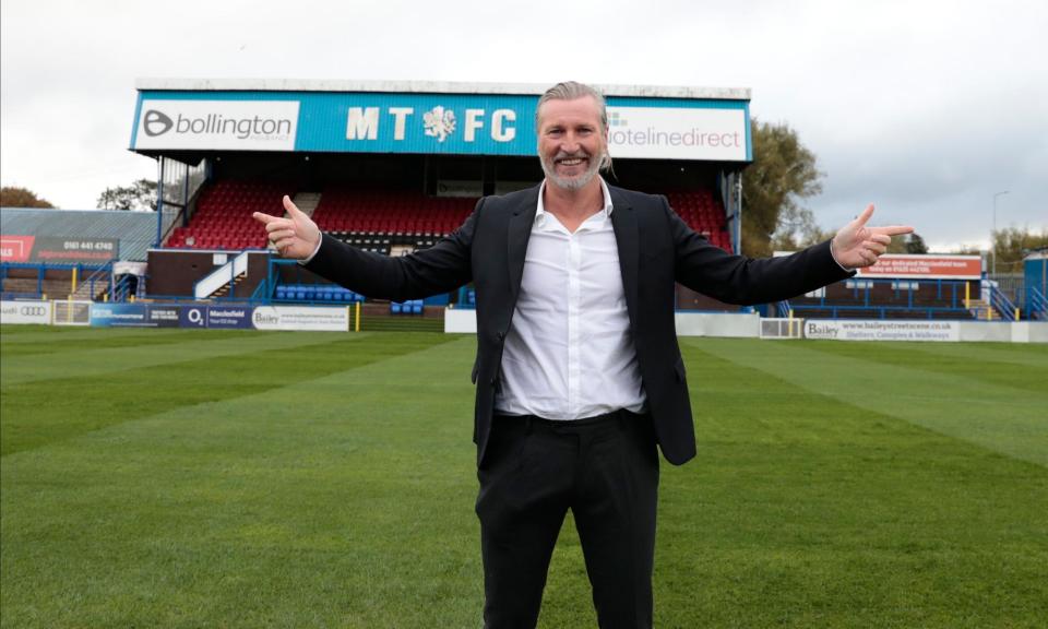 <span>Robbie Savage at Macclesfield’s Moss Rose stadium in 2020, the year he became involved.</span><span>Photograph: Conor Molloy/News Images/Shutterstock</span>