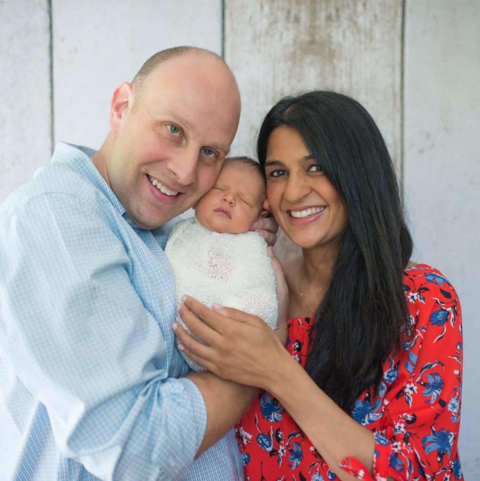 Family holding a baby  (Courtesy Shrina Grunow )