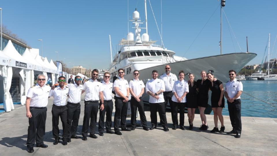 The crew of superyacht Mirage, chef in the center. - Credit: Courtesy MYBA