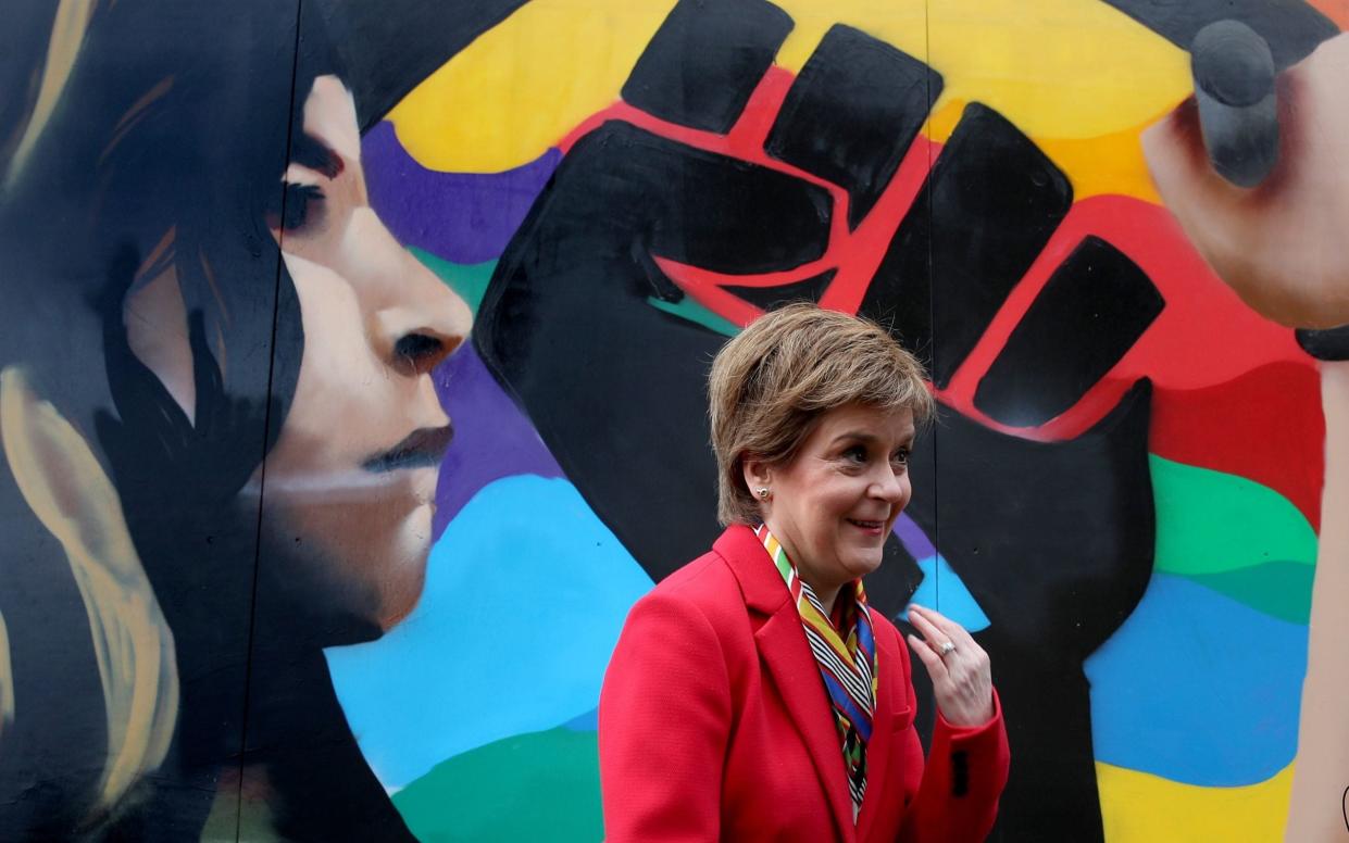 Nicola Sturgeon beside a Black Lives Matters mural in Glasgow, during campaigning for the Scottish Parliamentary election -  PA
