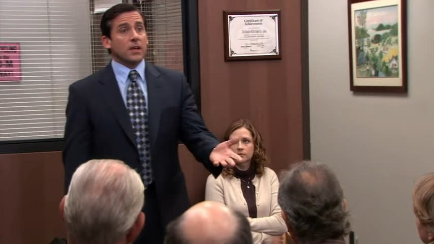 Michael giving a lecture with Pam sitting behind him in "The Office"