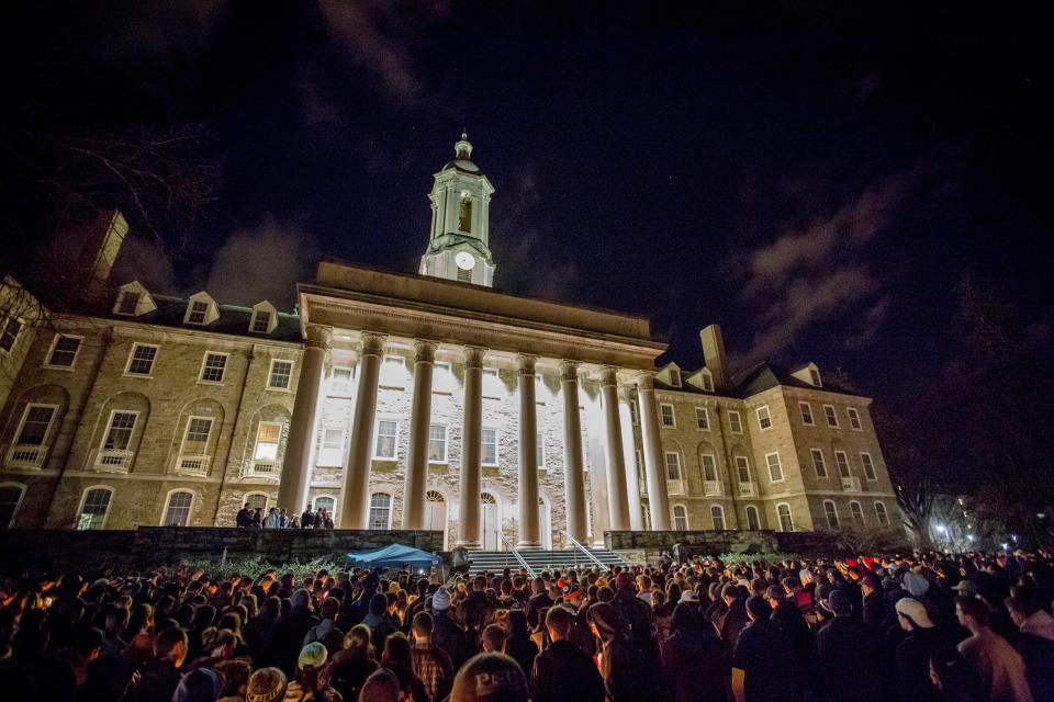 Students at Penn State gather for a candlelight vigil on Feb. 12, following Piazza’s death