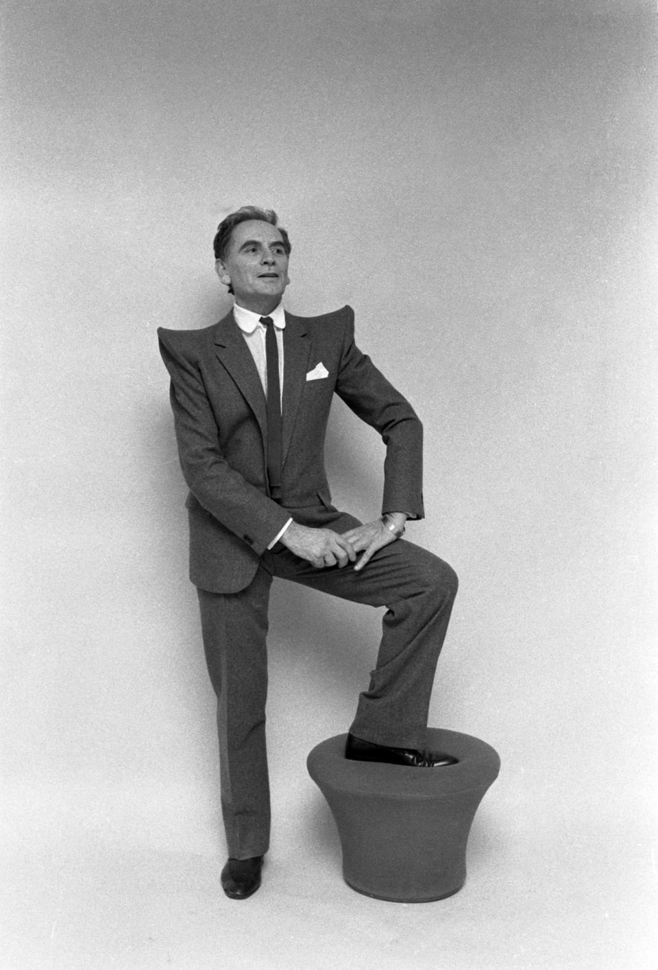 Pierre Cardin wearing a suit with prominent upwards sloping shoulders