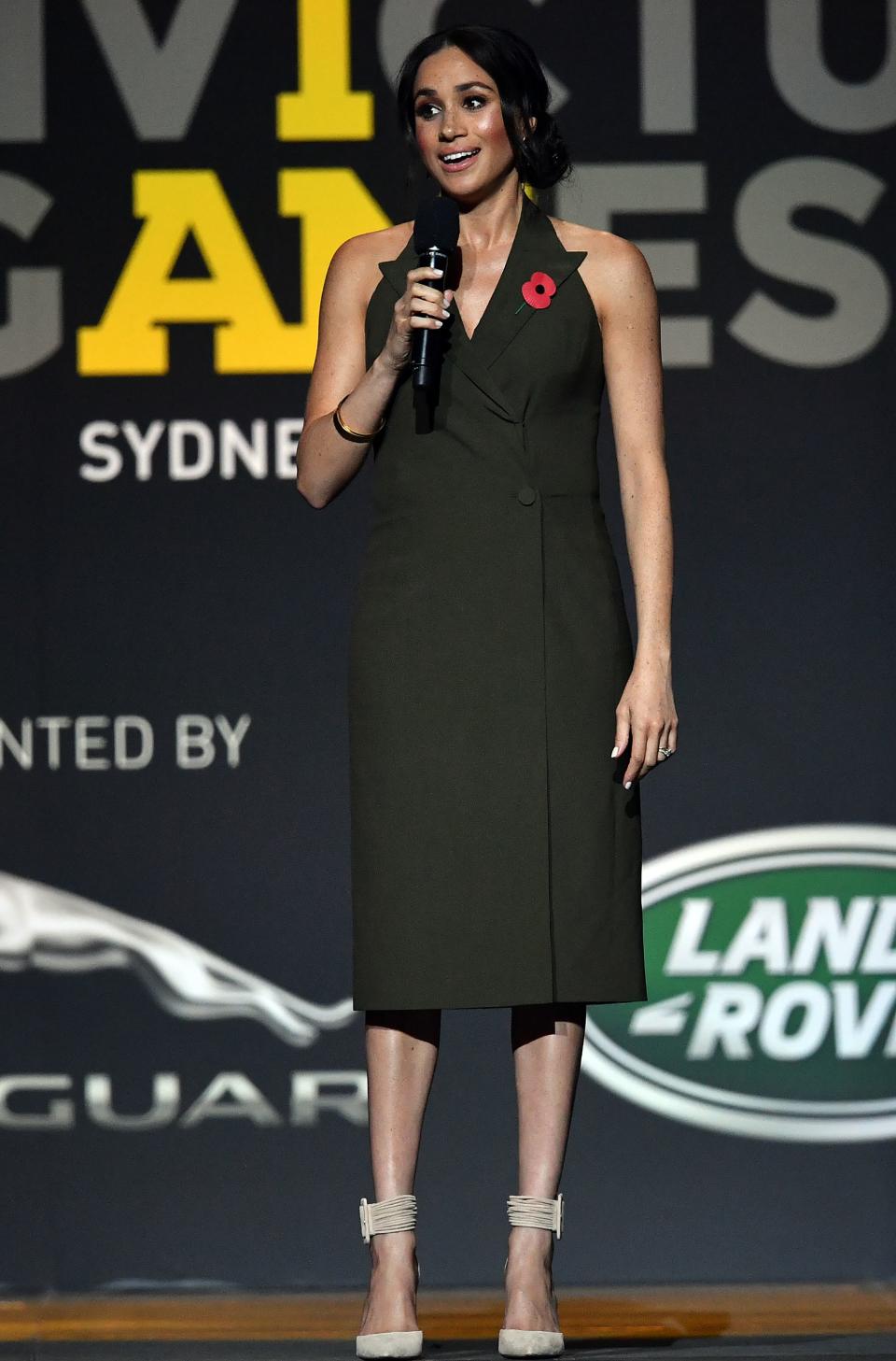 <p>On October 27, the Duchess of Sussex delivered a speech at the 2018 Invictus Games closing ceremony in a green Antonio Berardi tuxedo dress. <em>[Photo: Getty]</em> </p>