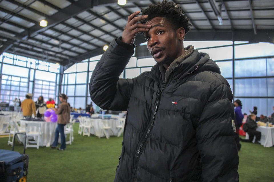 Derwin Catchings, who turned to squeegee work rather than making low wages at a city agency in order to get daily income flow, attends a resource and hiring event for squeegee workers prior to the enforcement of "disallowed zones" Friday, Jan. 6, 2023, in Baltimore. Catchings hopes to find work opportunities at UA House/Living Classrooms. (Karl Merton Ferron/The Baltimore Sun via AP)