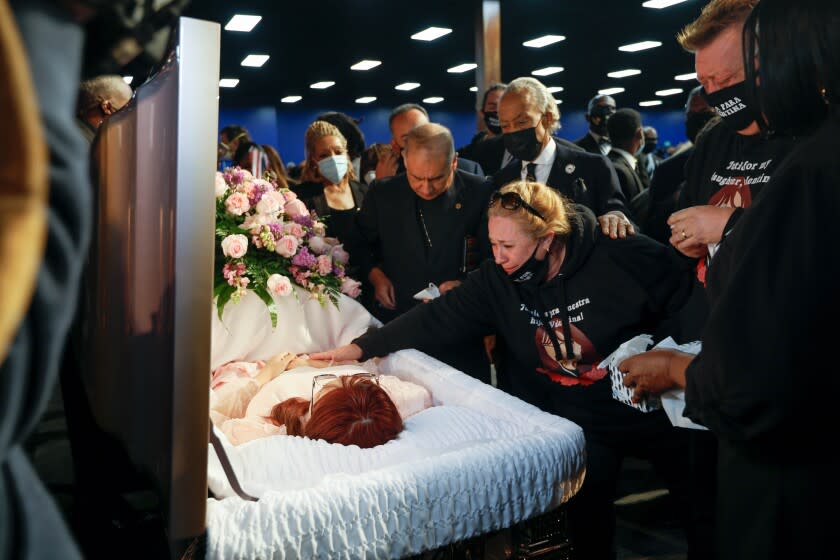 Soledad Peralta, the mother of Valentina Orellana Peralta, says goodbye to her daughter at the start of Valentina's funeral.