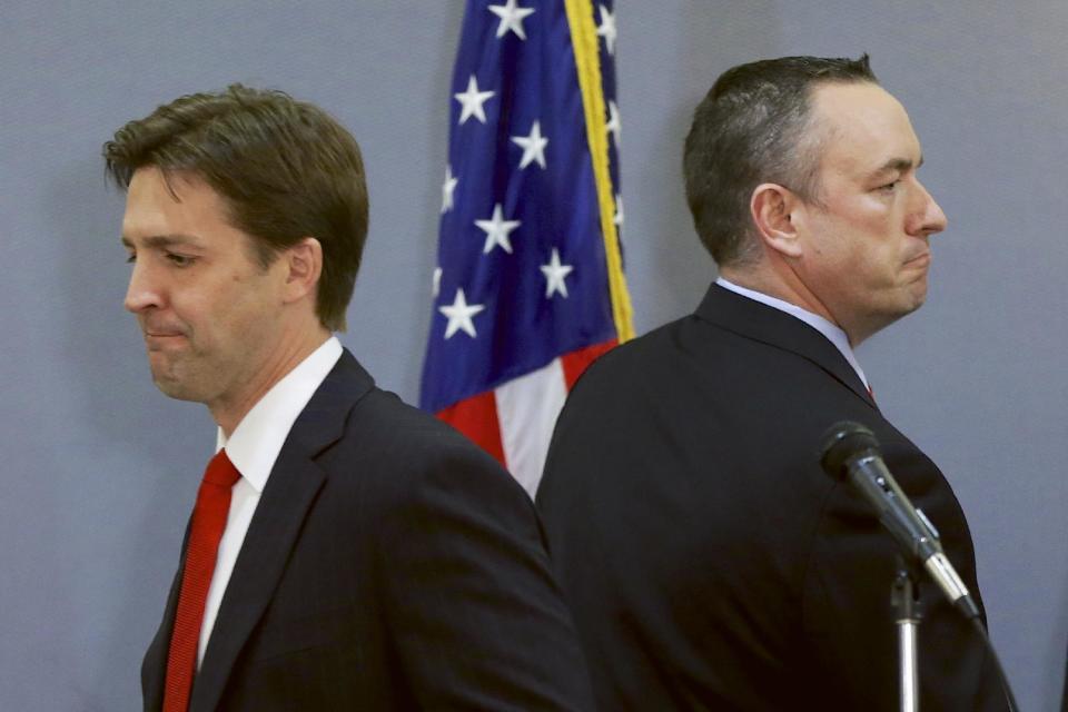 In this March 11, 2014 photo Republican-backed Senate candidate Shane Osborn, right, and tea-party backed Ben Sasse, left, leave the stage after a debate in Omaha, Neb. Compared with the acrimonious primary campaigns elsewhere, the race for the GOP Senate nomination in Nebraska sounds like two nice guys running for local Rotary Club president. But make no mistake, Nebraska is a new front in the bitter national struggle inside the Republican Party between established leaders determined to maintain control and right-wing insurgents trying to change the party’s direction. (AP Photo/Nati Harnik)